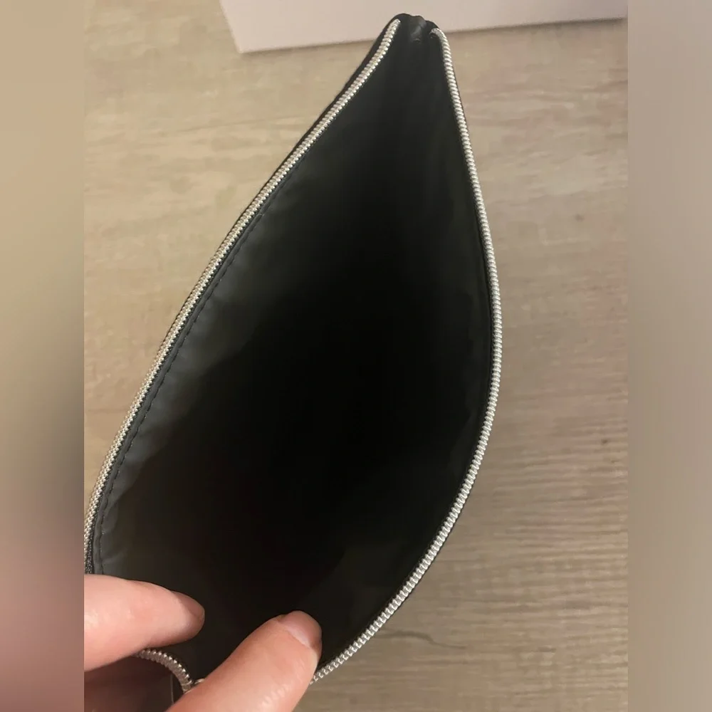 Authentic Dior flat pouch in Black. New. Comes with box.